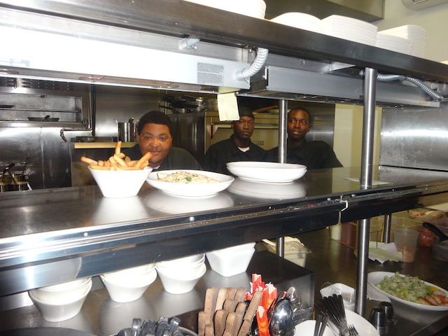 On the left sous chef Merez Culmer with 2 of the kitchen staff