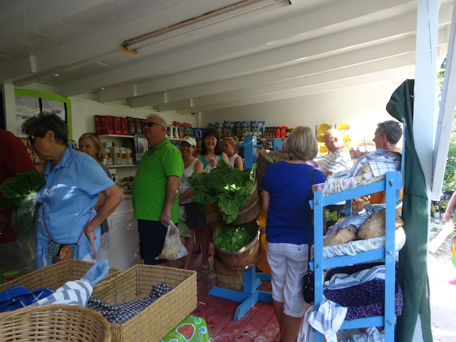 Happy people clutching goodies  at the Island Farm