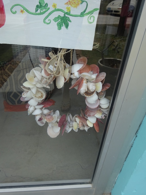 A shell door ring - although i would use it as a table centerpiece with candles in the middle....