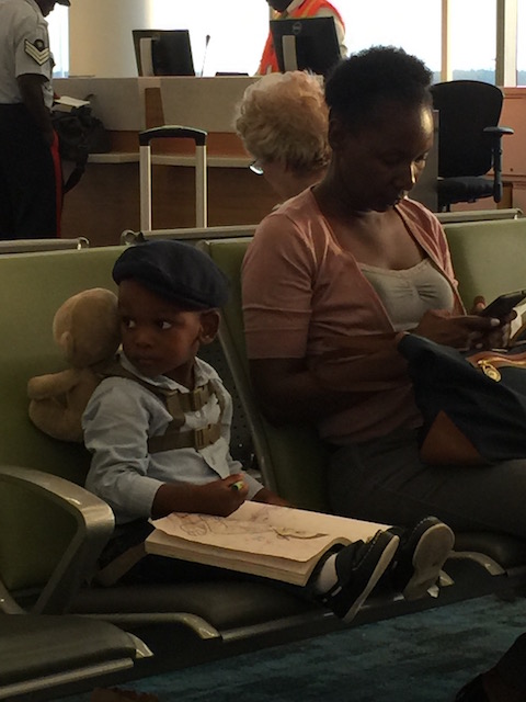 This little guy was too cute for words - doing his coloring in at Nassau airport