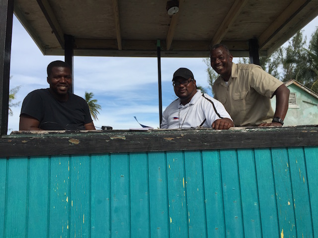 In the score box from l-r Wesley George, Sherwin Major and Jerry Seymour- chairman of the EBA