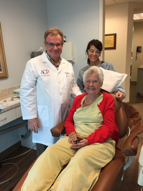 Mum with ace dentist Dr John Stone and his assistant Teresa
