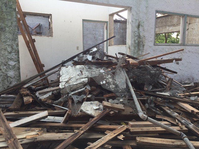 A little demolition at one of the houses - all the roofs have to come off but the structures are perfectly sound