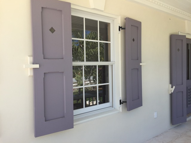 The shutters at Flora's House - notice the peep hole to look out through when the shutters are closed during a hurricane.