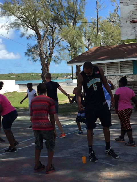 Keno Burrows with kids participating in Project Cay