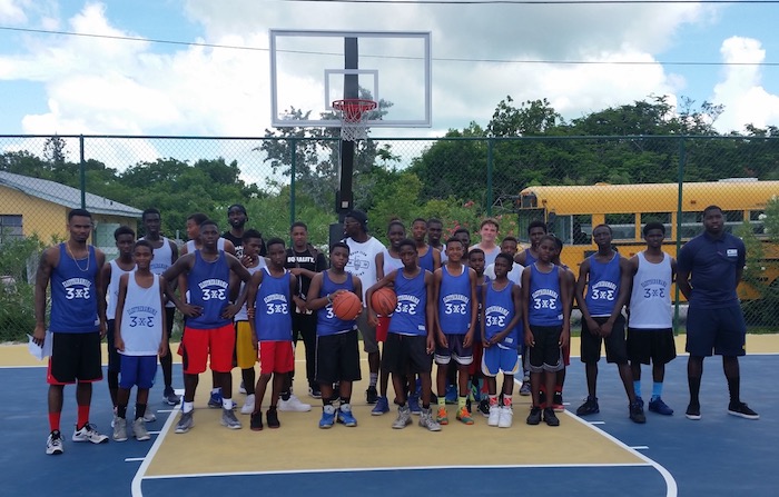 Competitors in their 3 x 3 shirts with donated basketballs at Wemyss Bight