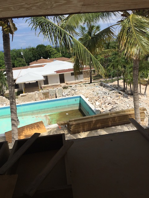 First coat of white paint on the roof of the restaurant. 