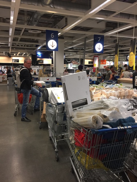 Bob waiting at the checkout in Ikea with 5 trolleys of goods ! Do you think he looks like a happy birthday boy ??