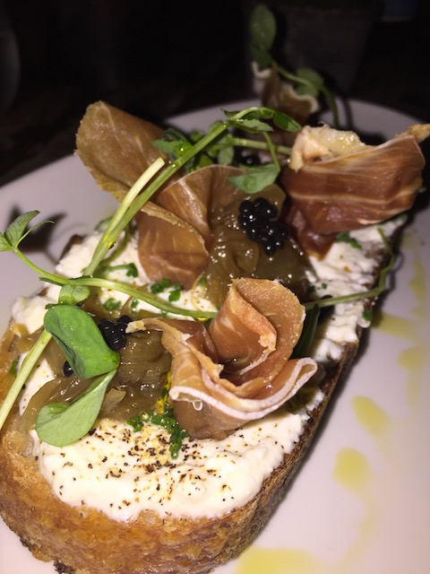 This is so good - truffled ricotta on toast with prosciutto at One Door East