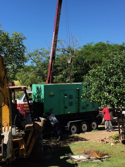 OK - the crane starts to pick up the generator