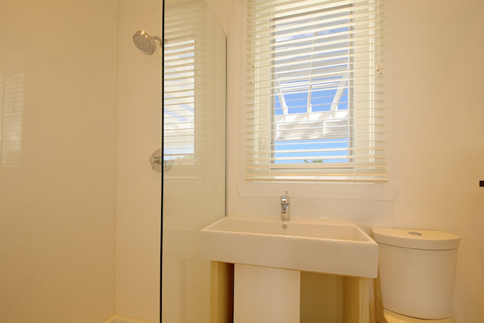 I wasn't going to include this picture as the bathroom had not been dressed for the photo shoot but the blue sky through the window seen through the pergola is so lovely I had to put it in....