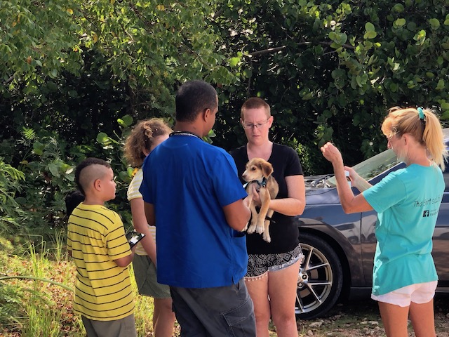 Dr Davis with Tanya Knowles and one of her pups