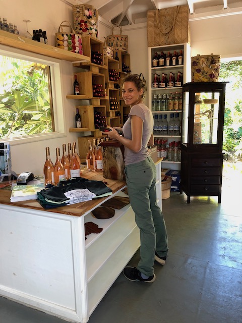 The lovely Rea Bethel stocking the shelves with a great rose wine....