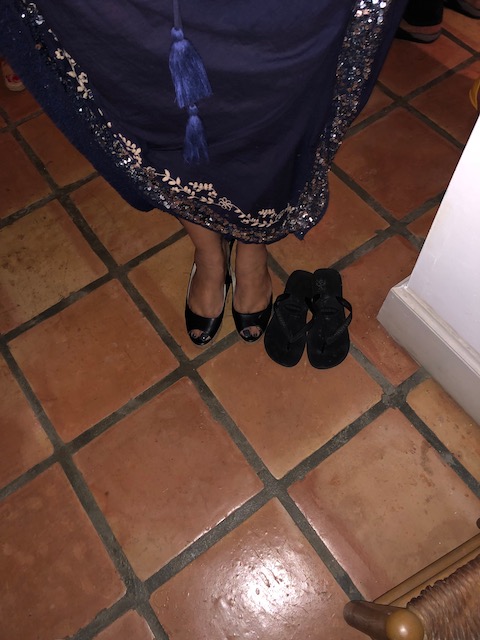 Angelika was the most sensible person out on new Year's Eve - party shoes on - walking from house to house shoes waiting !