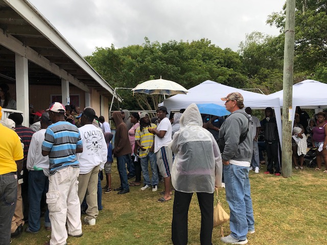 Queuing up in the rain to see the dentists....